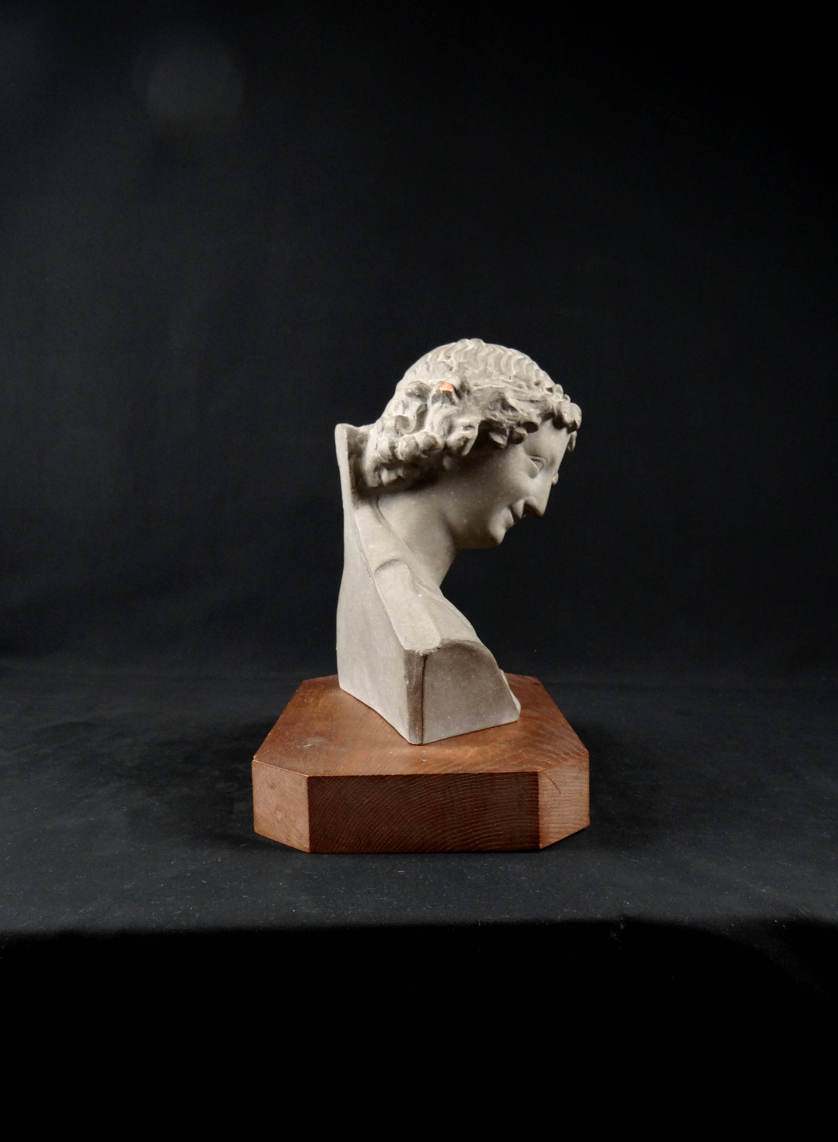 Terracotta bust of the smiling angel from Reims Cathedral with base