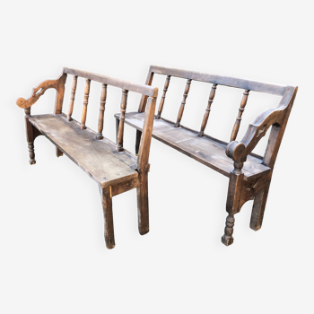 Duo of old oak church benches.