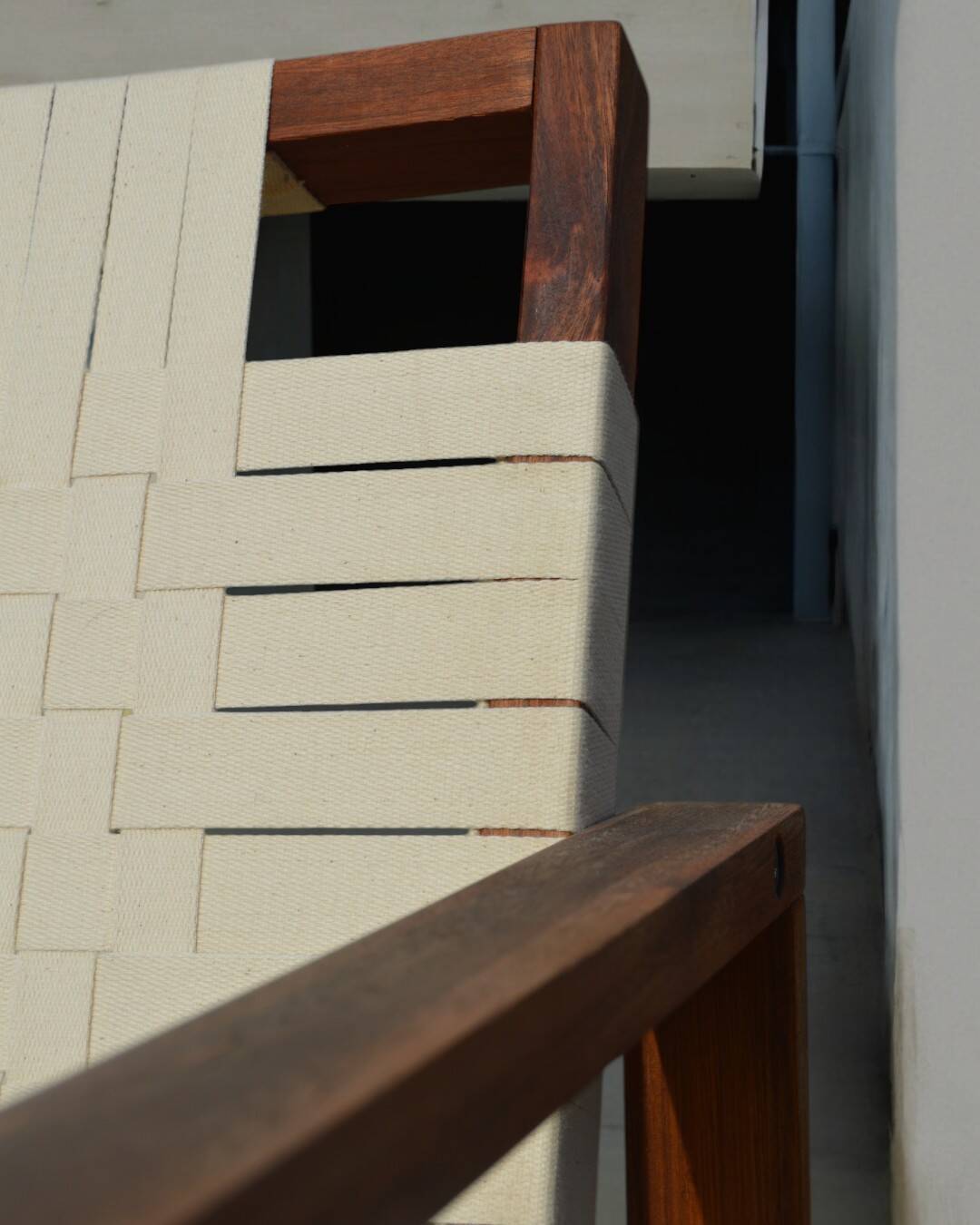 Teak armchair with woven seat