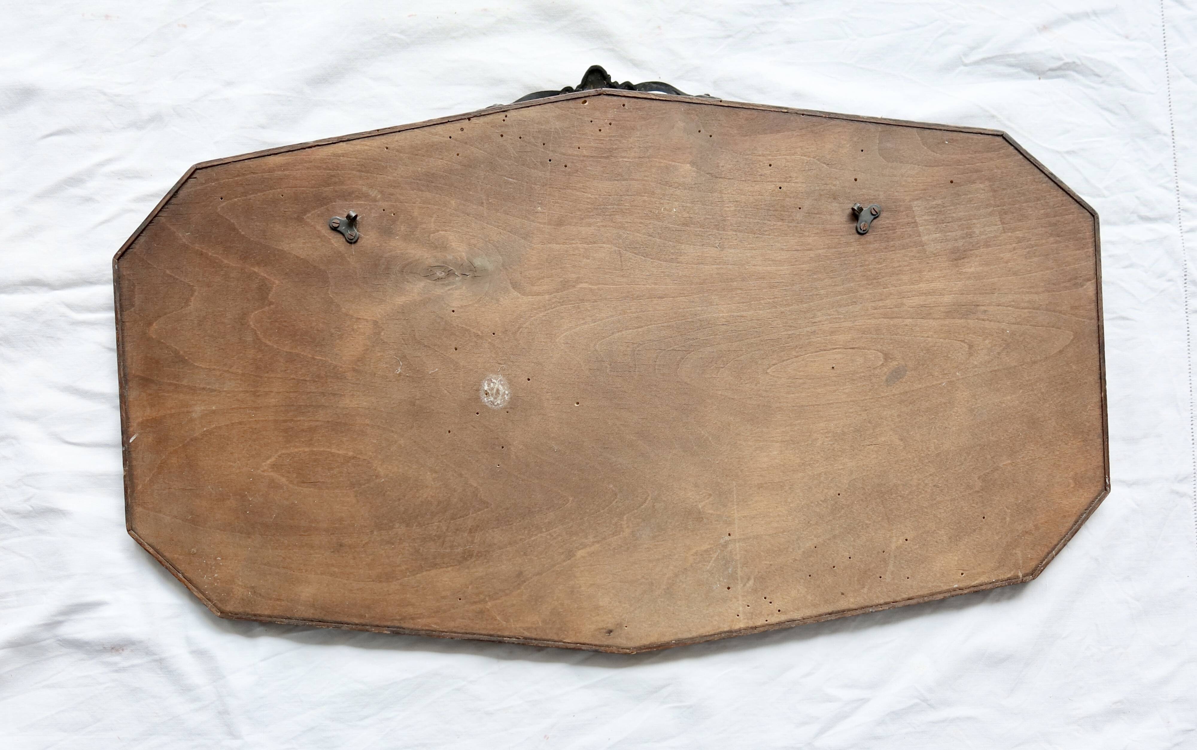 Large antique beveled mirror – dark wood and decorative bronzed metal knot
