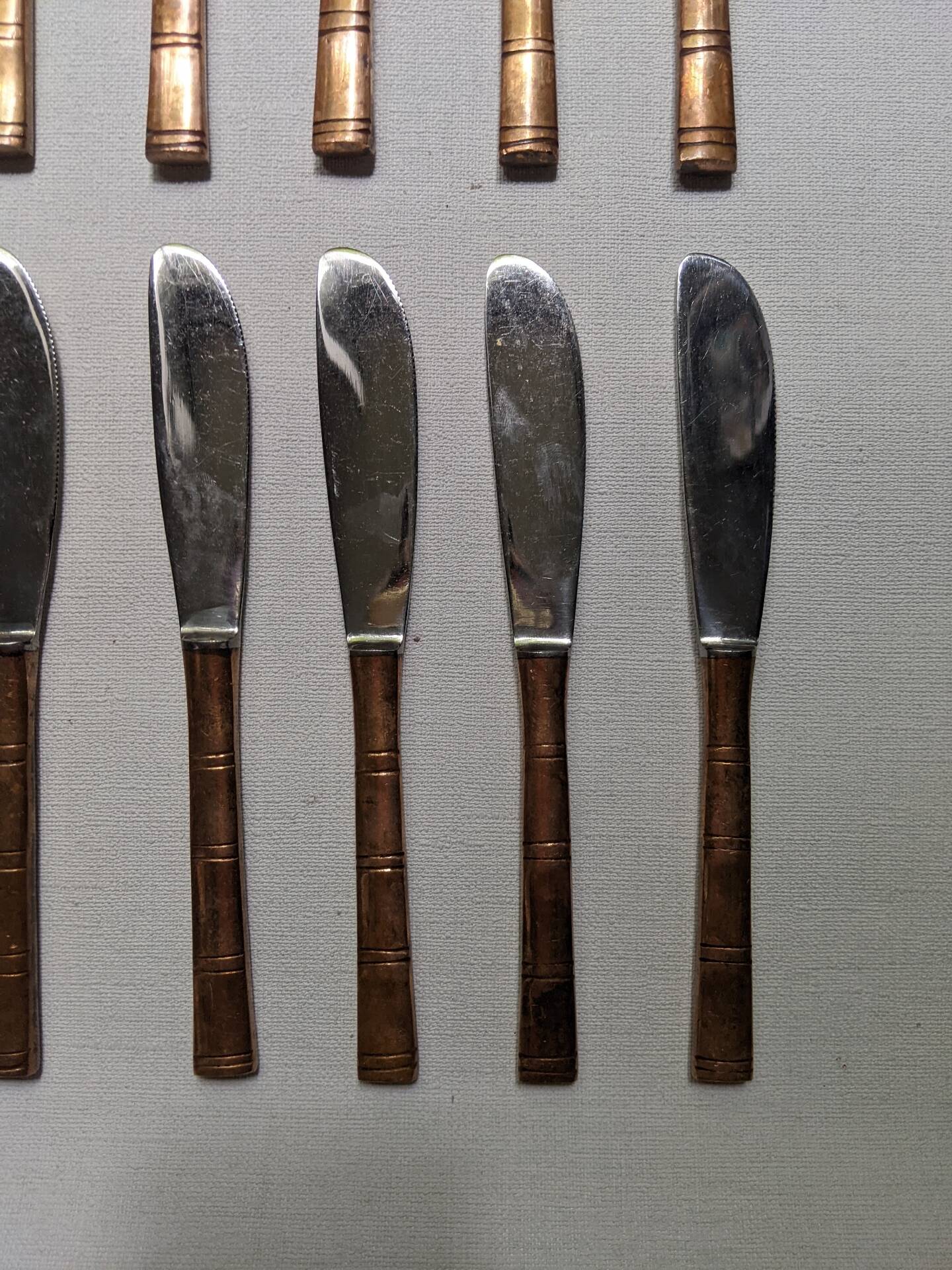 Set of 12 bamboo-style dessert knives in brass.