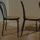 4 Black metal bistro chairs with plastic cane seat