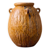 Ribbed earthenware jar with loop handles.