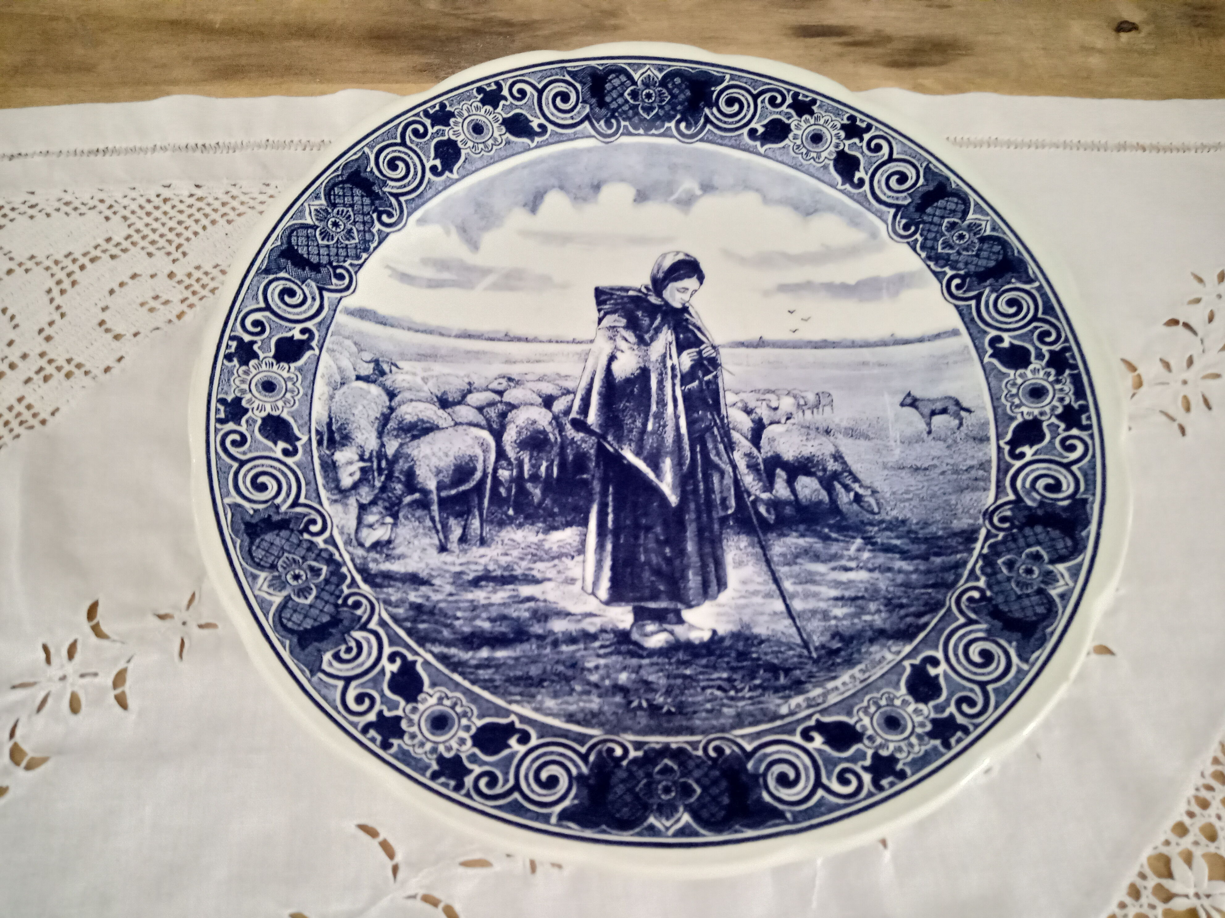 Round dish hollow Delfts decorating shepherdess and her sheep