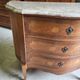 Curved chest of drawers in rosewood and marble marquetry