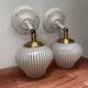 Pair of vintage white globe tilting wall sconces