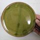 Small plate in glazed green earthenware
