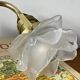 Swan neck wall light in brass with rose petal glass shade.