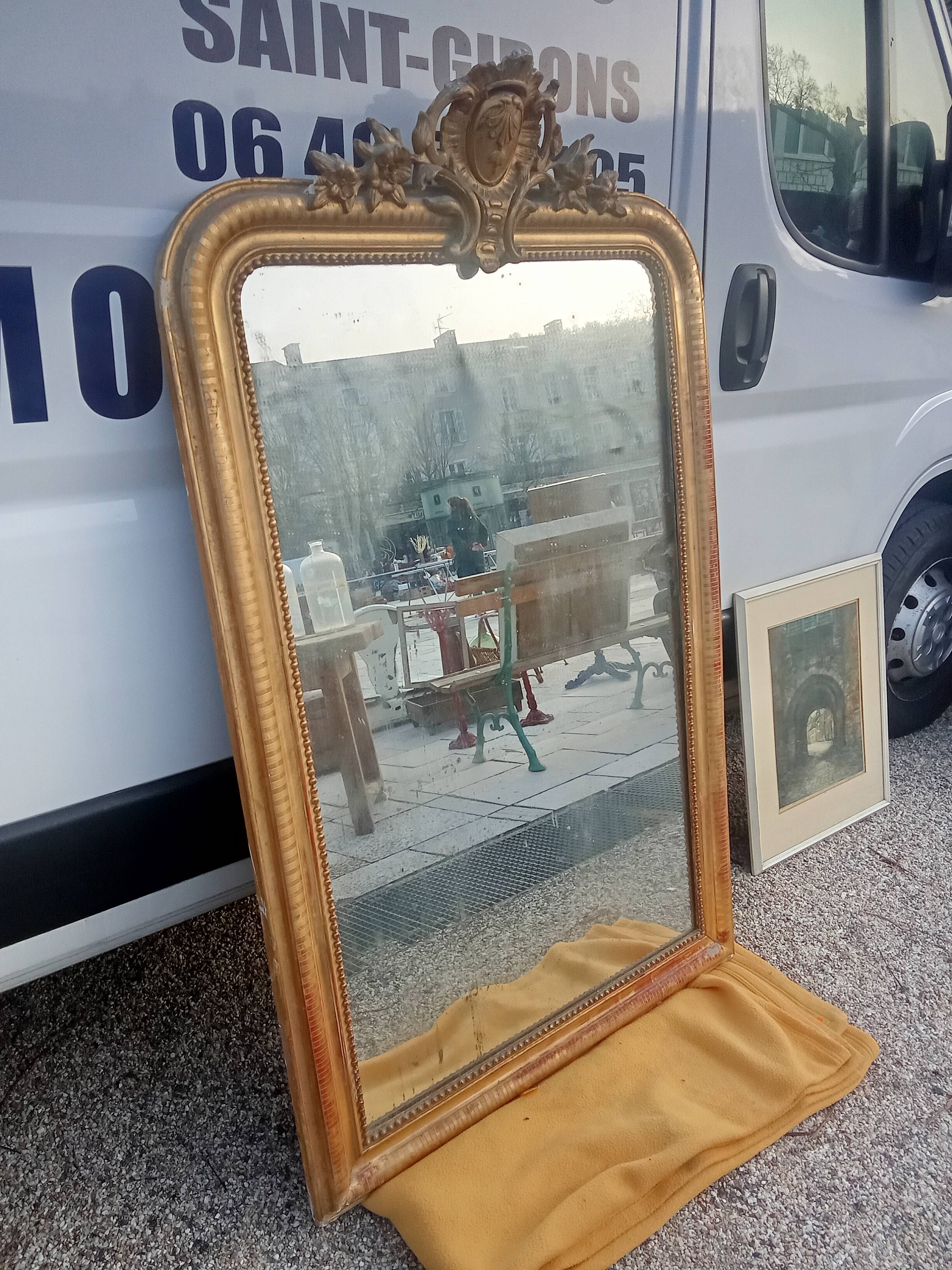 Antique Louis Philippe mirror gilded with gold leaf.