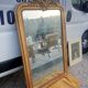 Antique Louis Philippe mirror gilded with gold leaf.