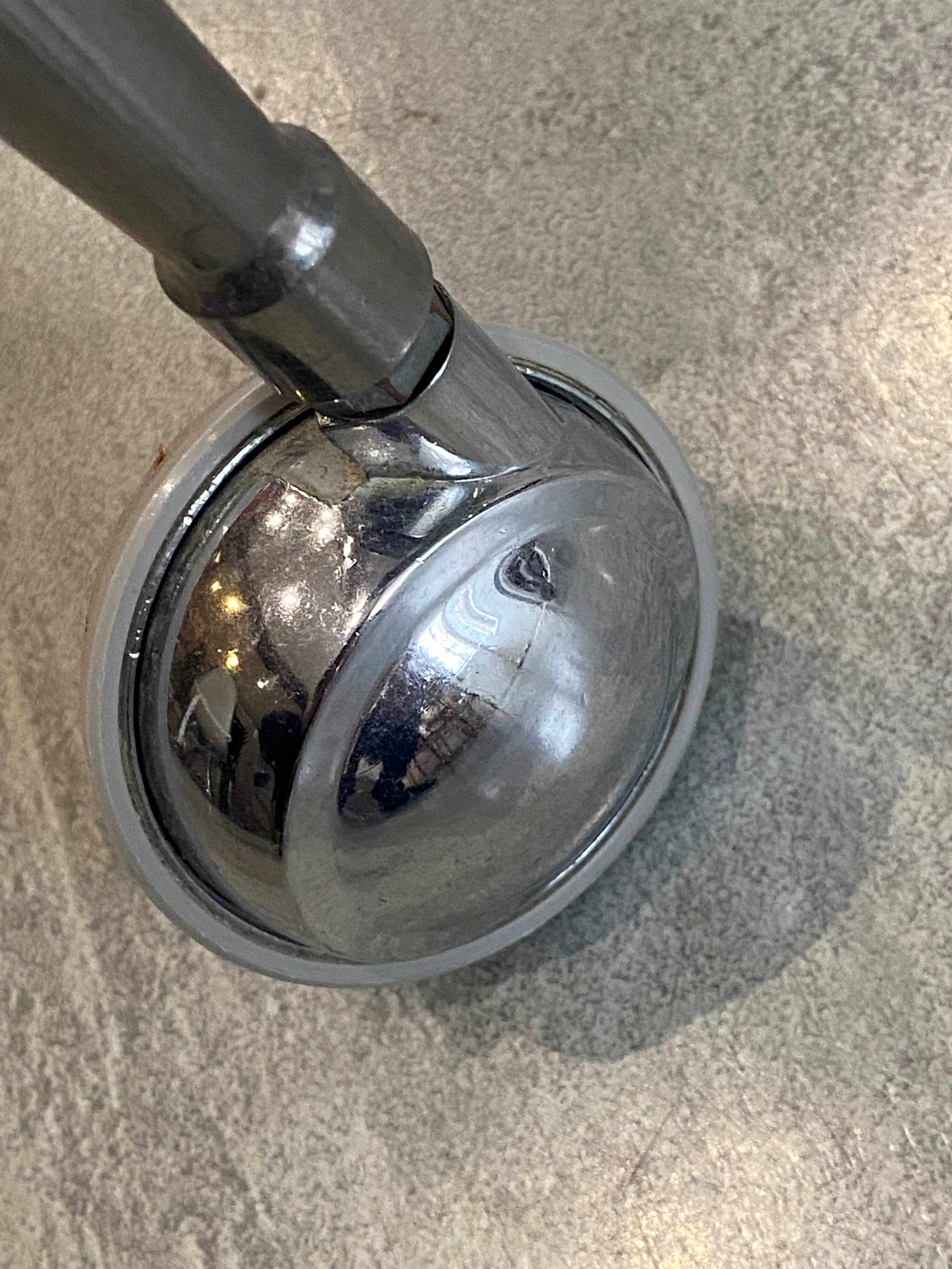 Vintage 1950s silver metal bar cart with wheels and two glass shelves