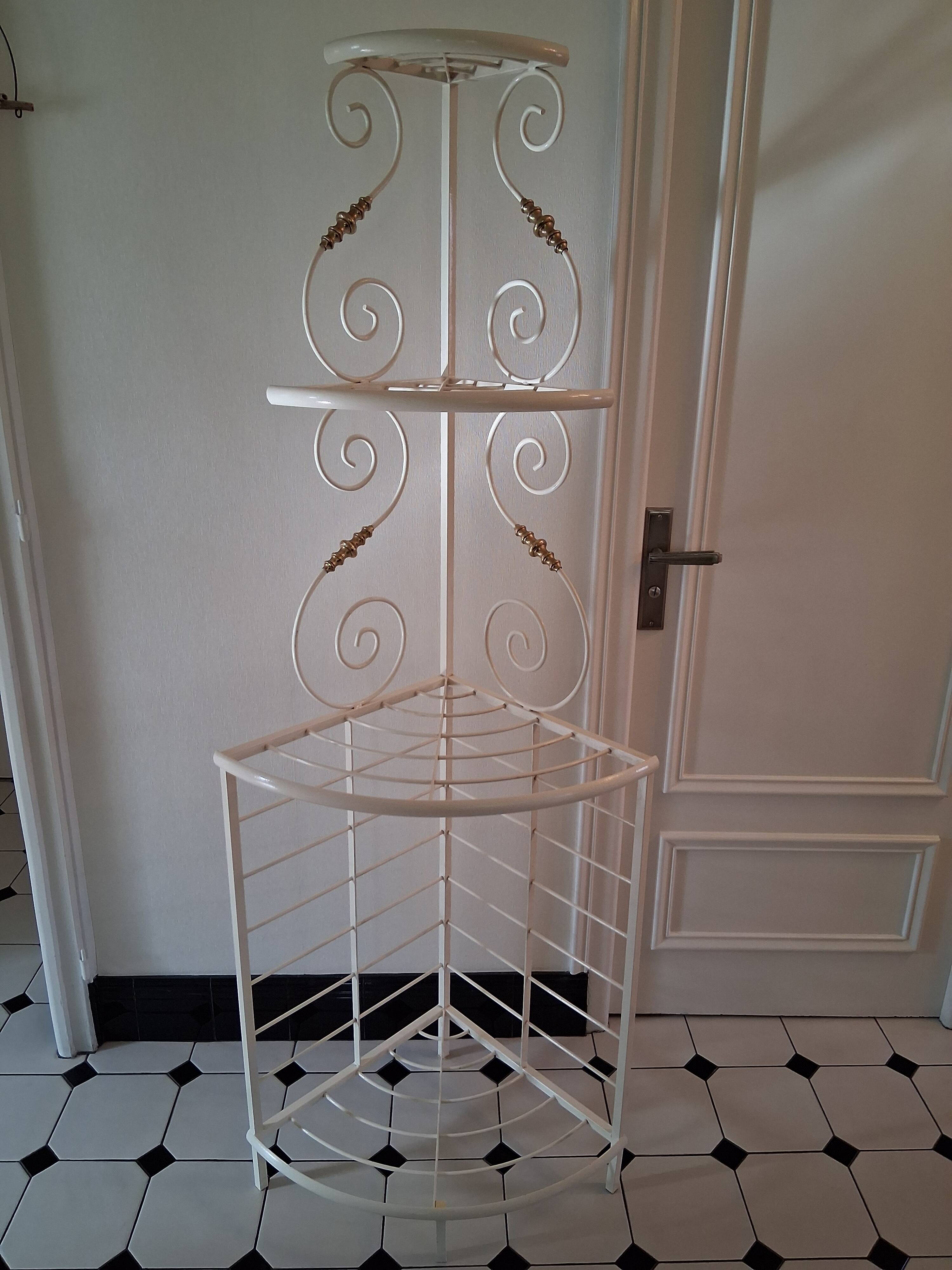 Cream and brass corner bakery shelf in wrought iron