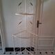 Cream and brass corner bakery shelf in wrought iron