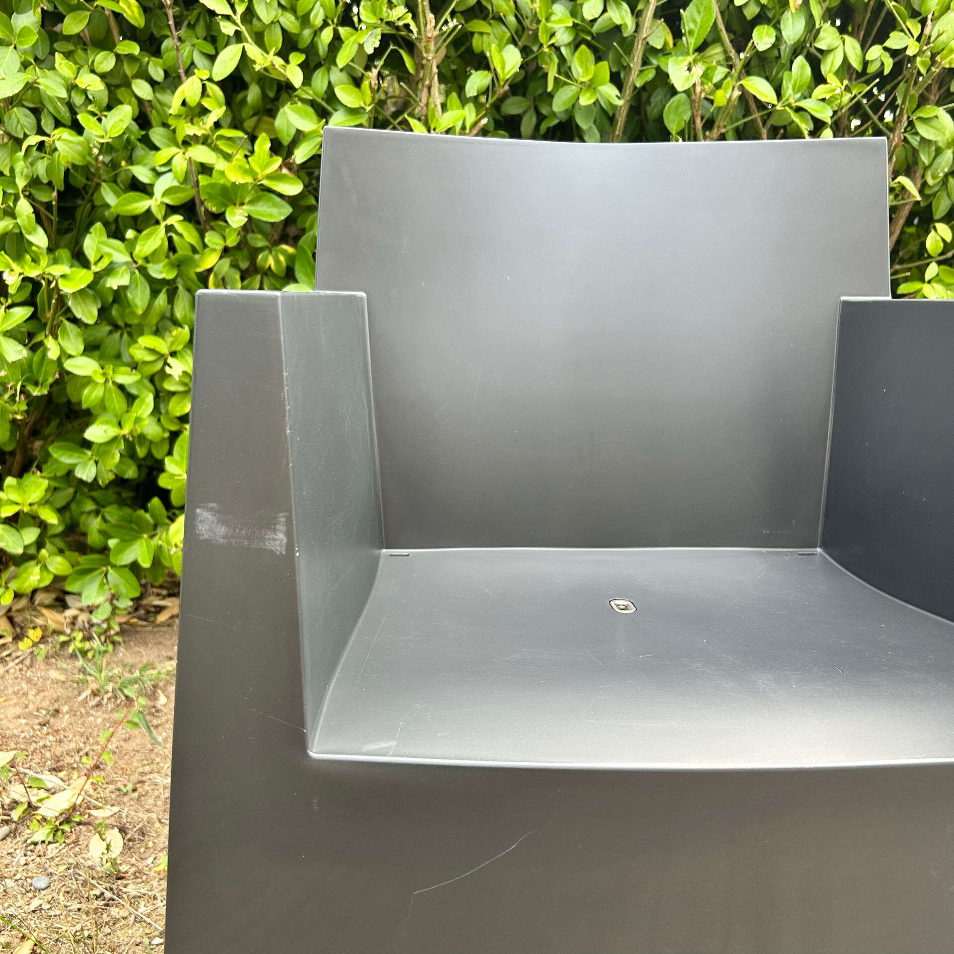 2 black Toy chairs designed by Starck