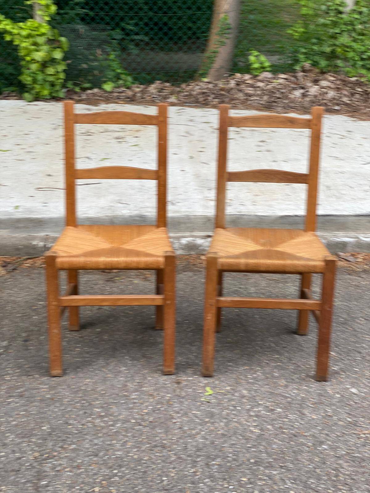 2 solid wood and straw chairs