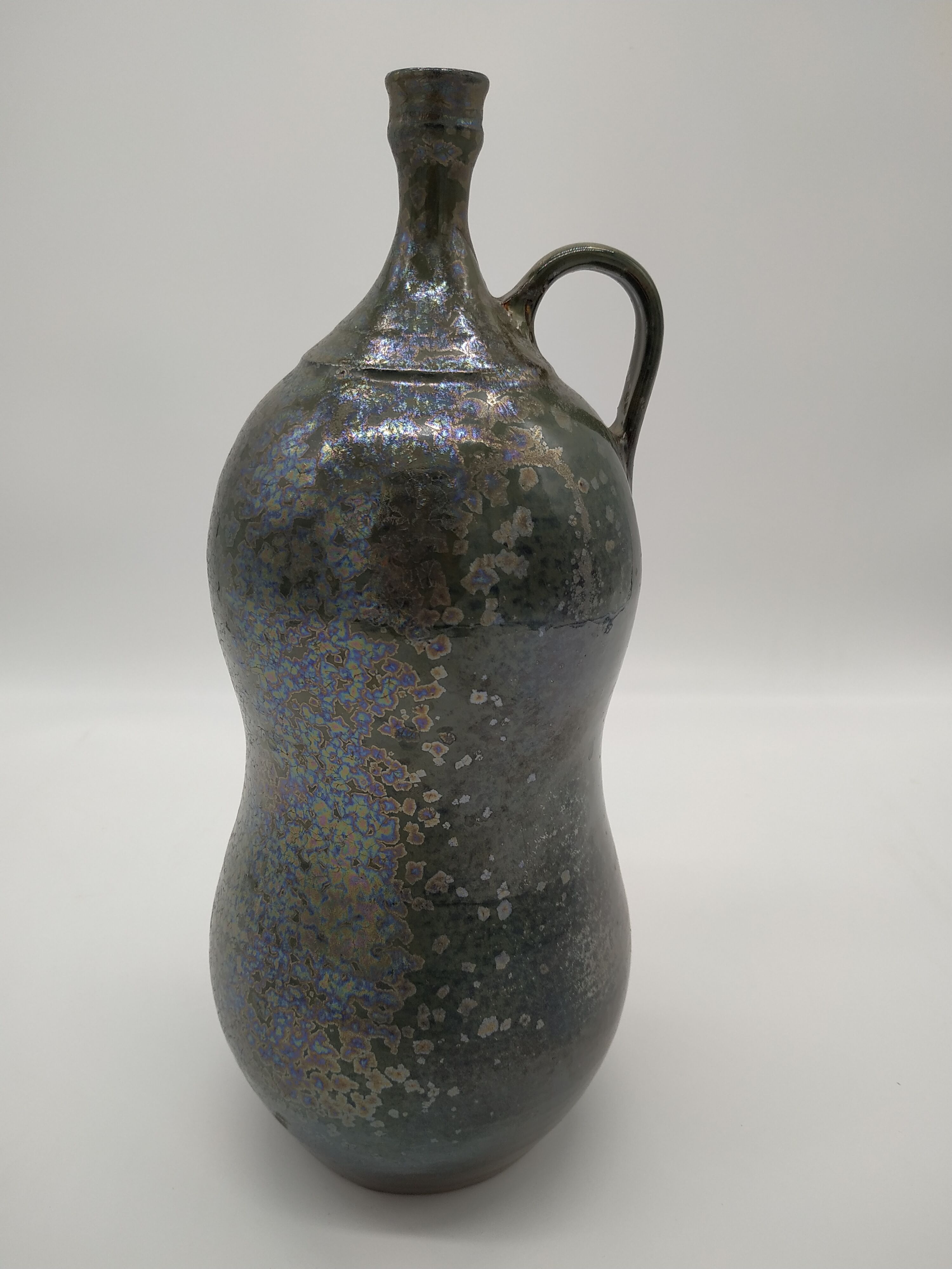 Bottle in iridescent green sandstone from the ceramist jean aimé Poirier