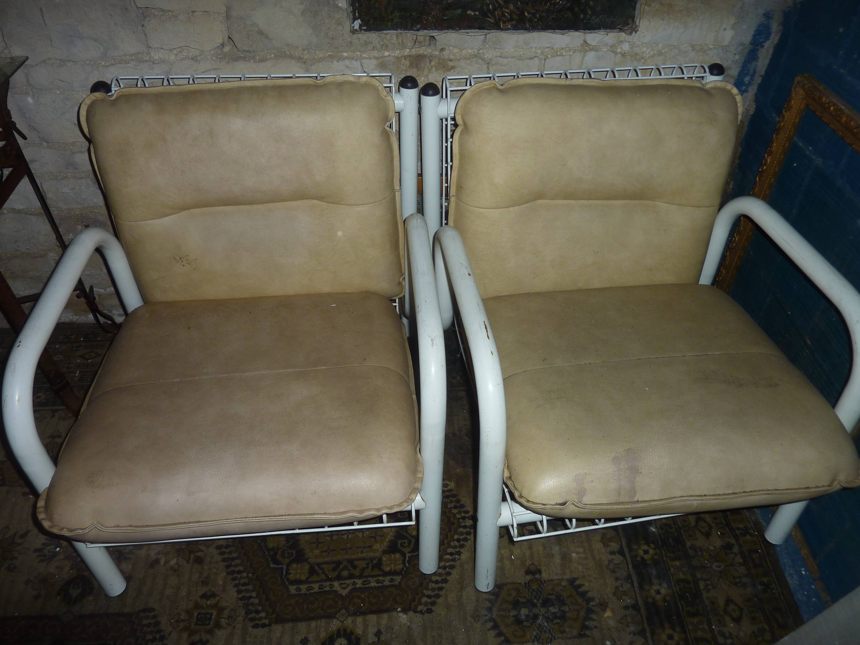 pair of iron armchairs