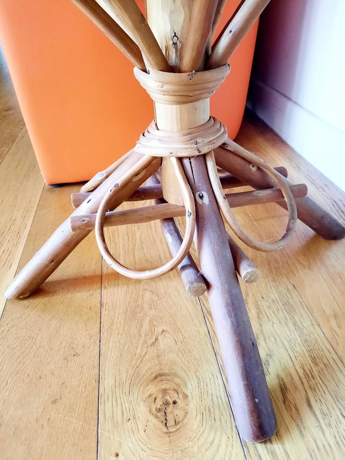 Old bamboo/rattan table with woven palm leaves.