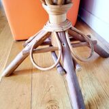 Old bamboo/rattan table with woven palm leaves.