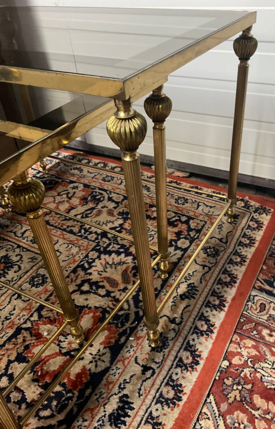 Series of 3 empire style nesting tables in brass and glass