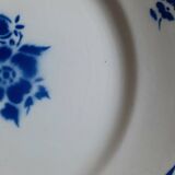 Old mismatched earthenware dinner plates
