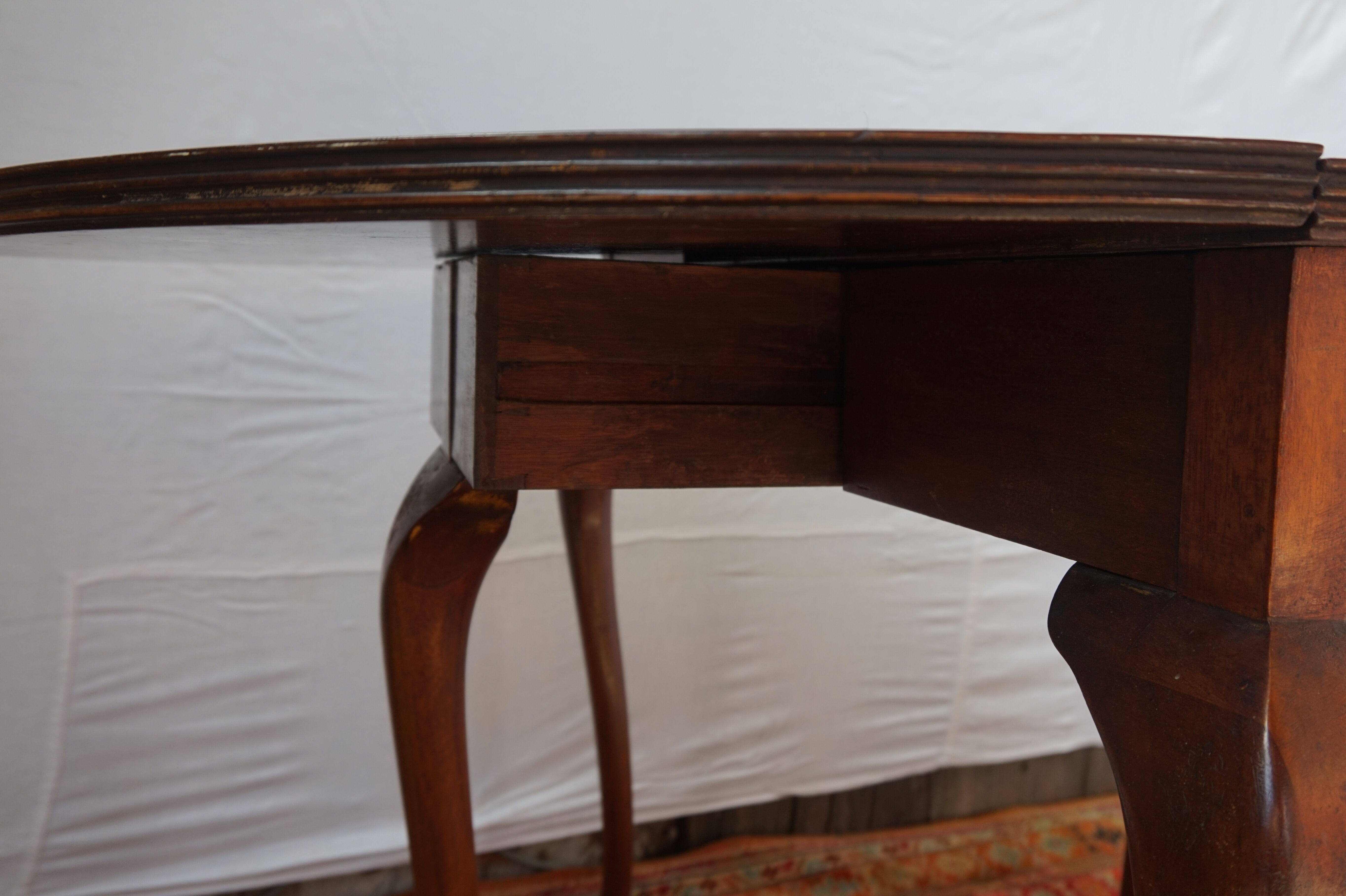 A half-moon english mahogany games table