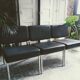 3 black armchairs