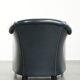 Dark blue club armchair made of cowhide leather with a timeless design