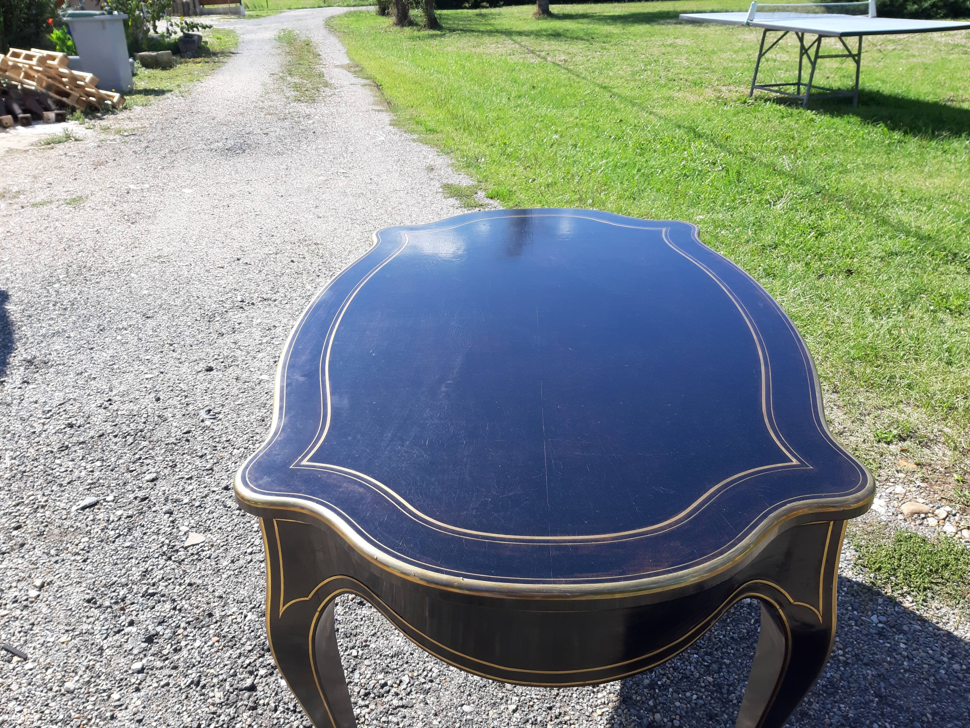 Napoleon III black lacquered wood and brass table