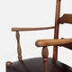 Antique rustic armchair in walnut and leather, 18th century.