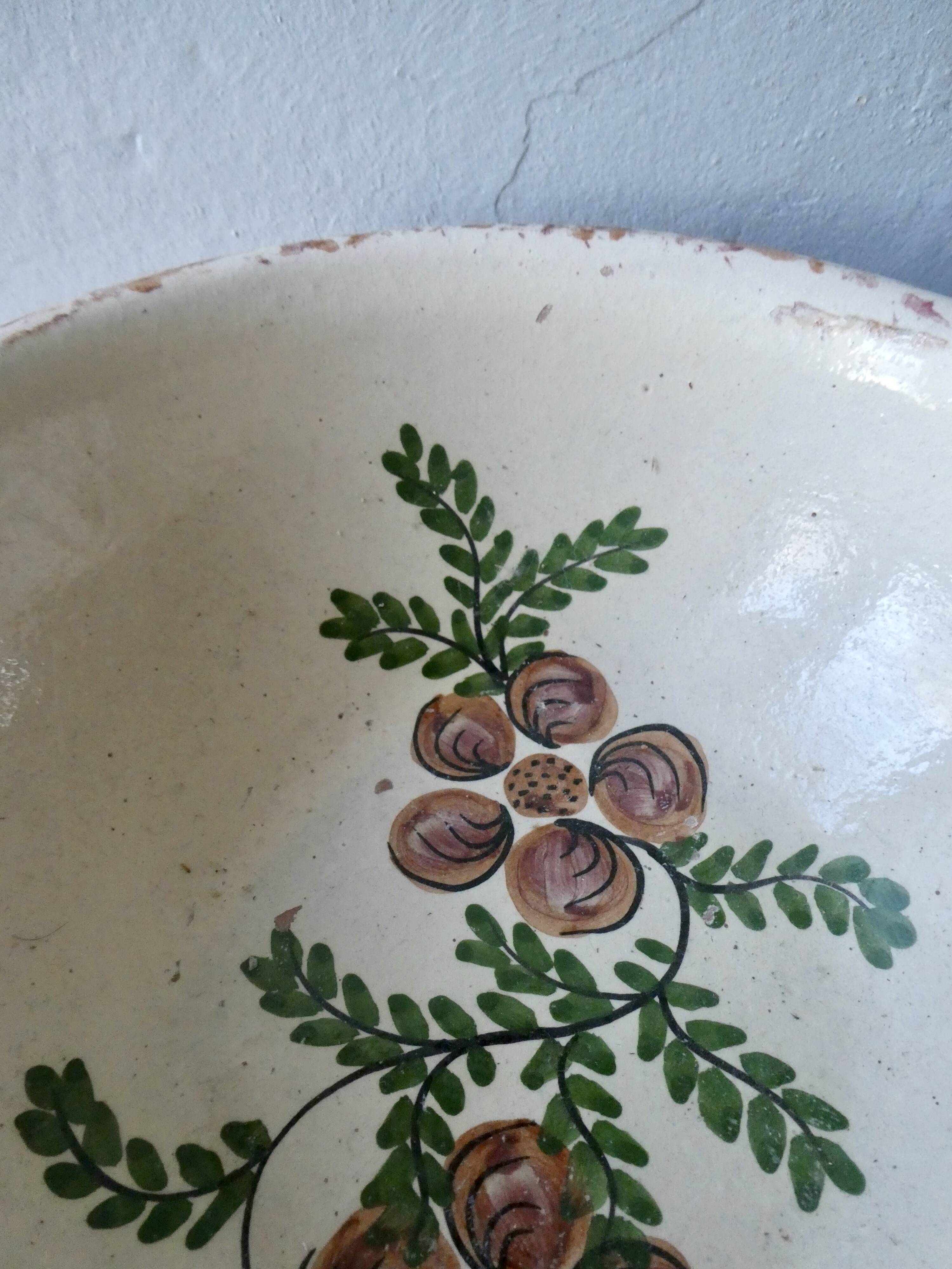 Hollow plate in enamelled terracotta