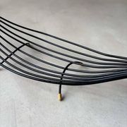 Minimalist black steel wire fruit bowl from the 1950s.