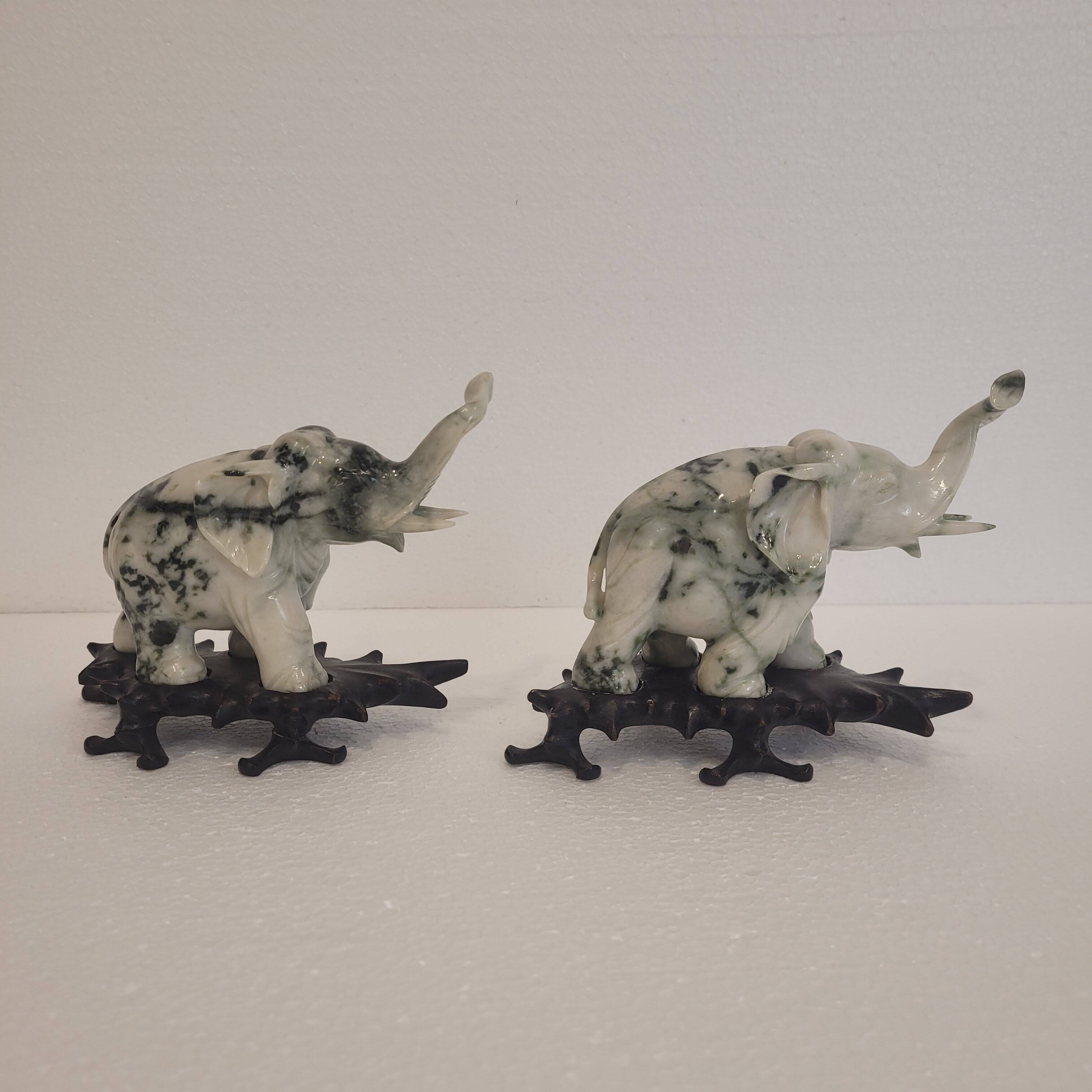 Pair of elephant paperweights, veined marble, 80s - France