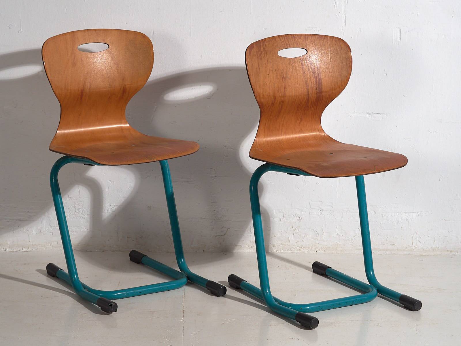 Vintage turquoise blue school chairs (c.1950). Set of 4 pieces