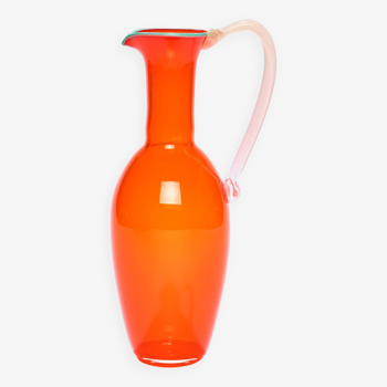 Tall pitcher in bright orange