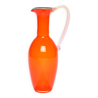 Tall pitcher in bright orange