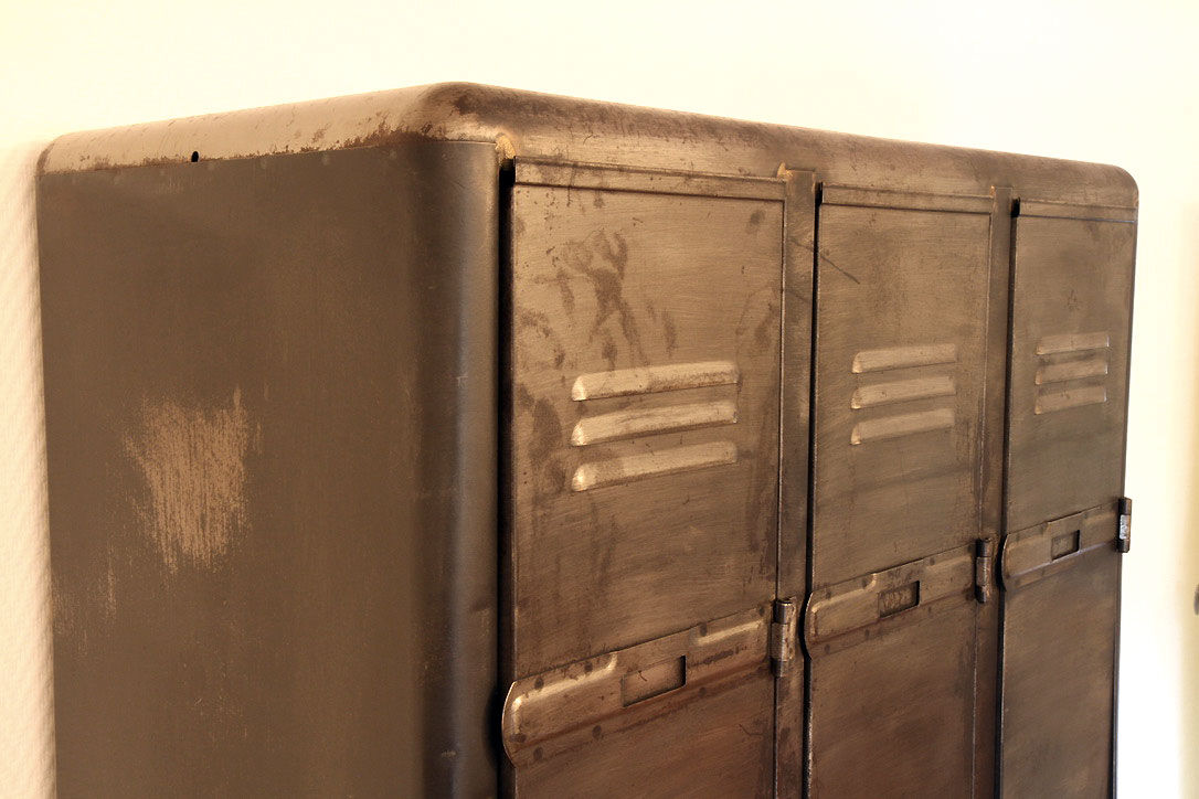 Industrial metal cloakroom with rounded corners.