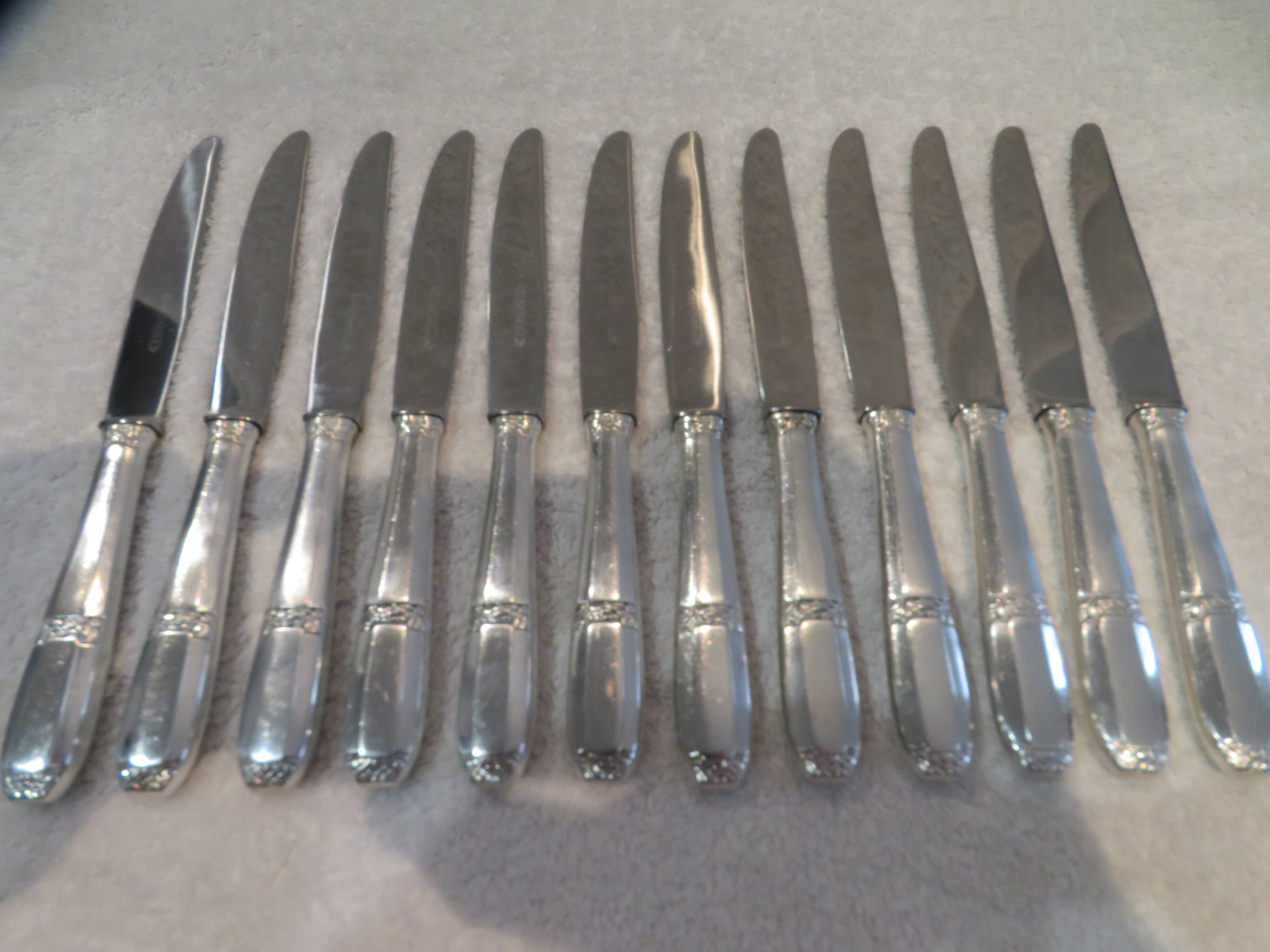 12 silver-plated dessert knives by Argit goldsmith? Art Deco floral bands