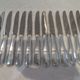 12 silver-plated dessert knives by Argit goldsmith? Art Deco floral bands