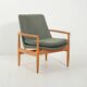 Scandinavian oak and sage-green wool armchair