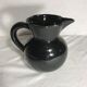 Former enamelled ceramic black pitcher 70s