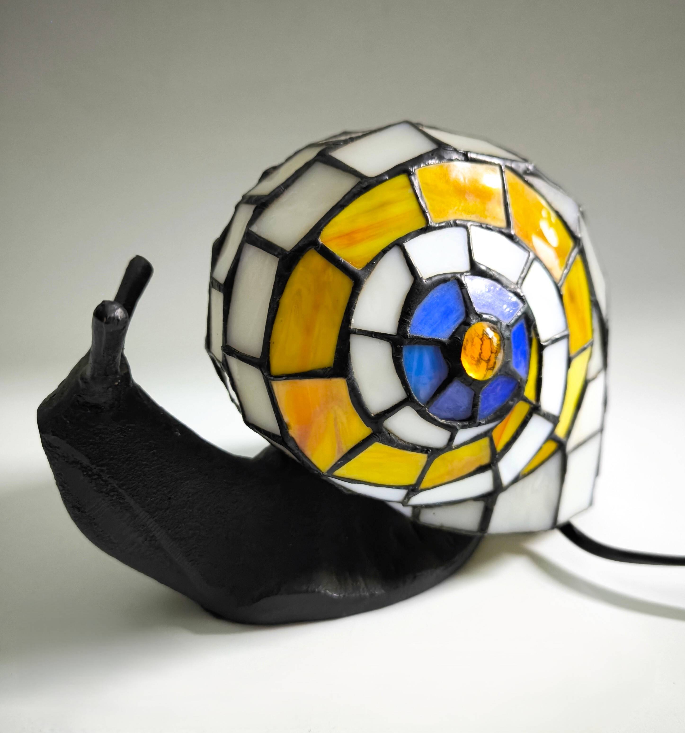 Tiffany-style lamp in the shape of a snail.