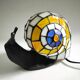 Tiffany-style lamp in the shape of a snail.