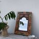 Petit miroir en bois ancien sculpté de fleurs 36x25