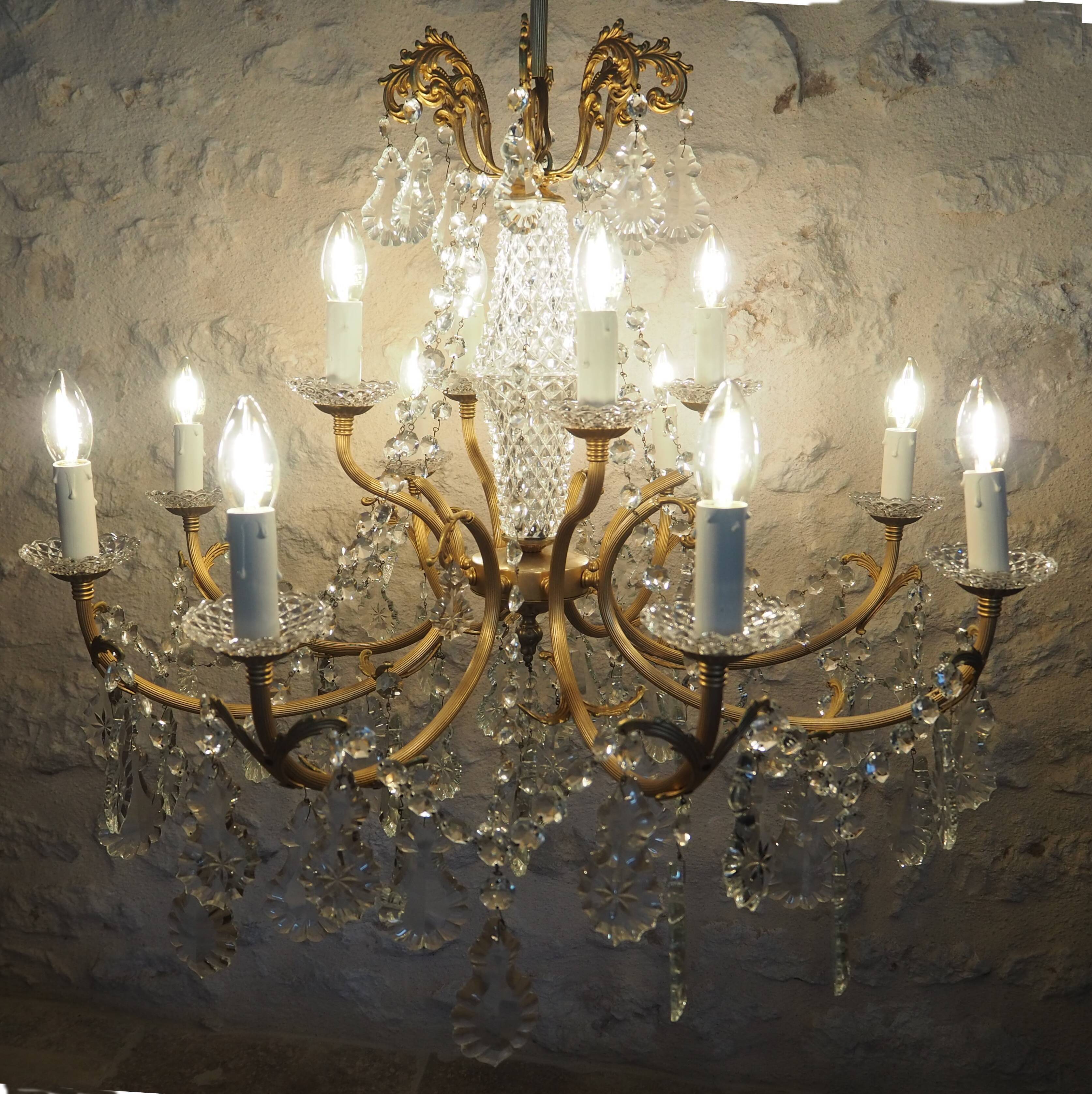 Chandelier 12 lamps with grapevines in crystal, bronze and regulated