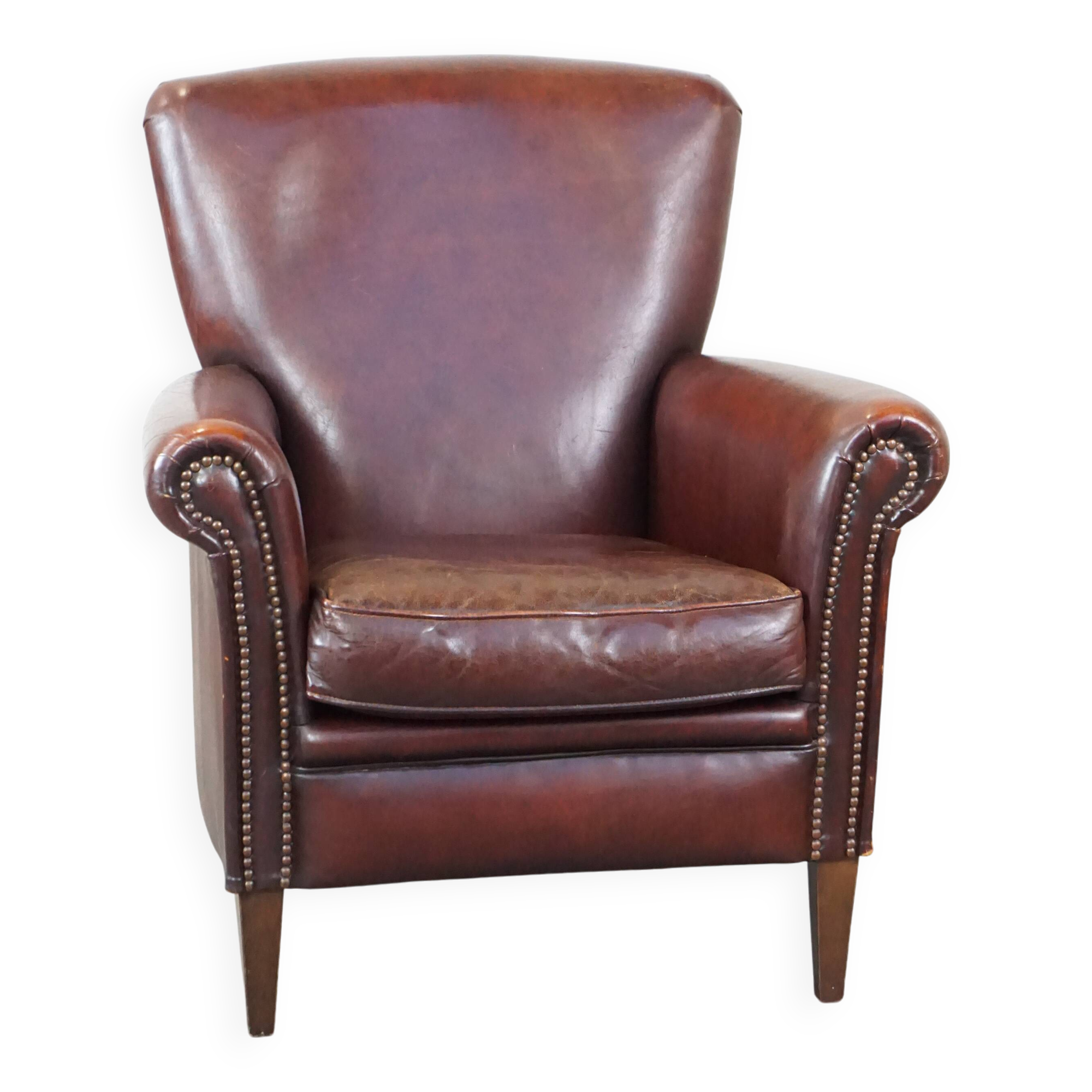 Sheep leather armchair correctly finished with decorative nails