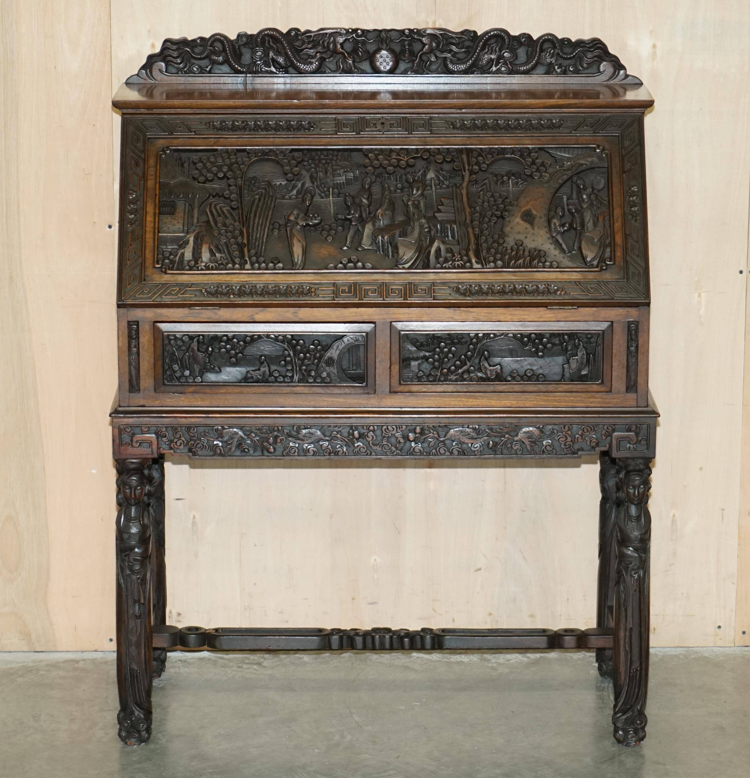 Chinese hand-carved desk from around 1940 with matching chair.