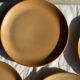 Set of 4 flat dinner plates in stoneware, no brand underneath.