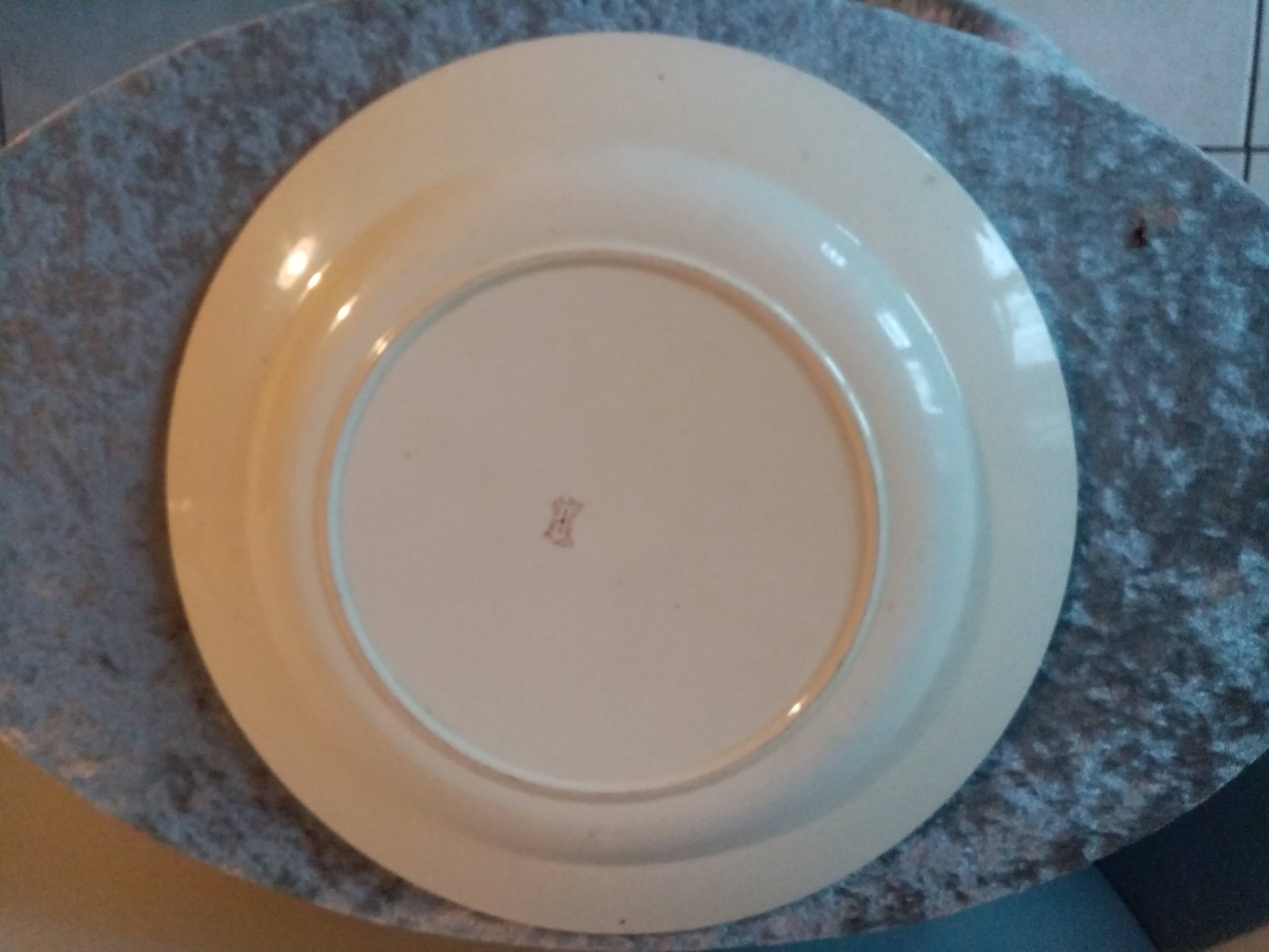 Old round earthenware dish from kg luneville with brown floral decoration