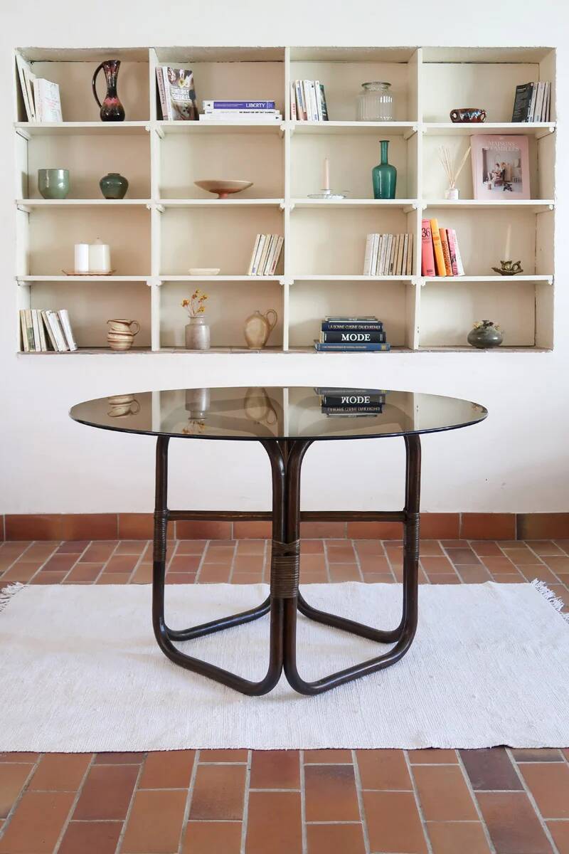 Round dining table in rattan, smoked glass top, 1970s.